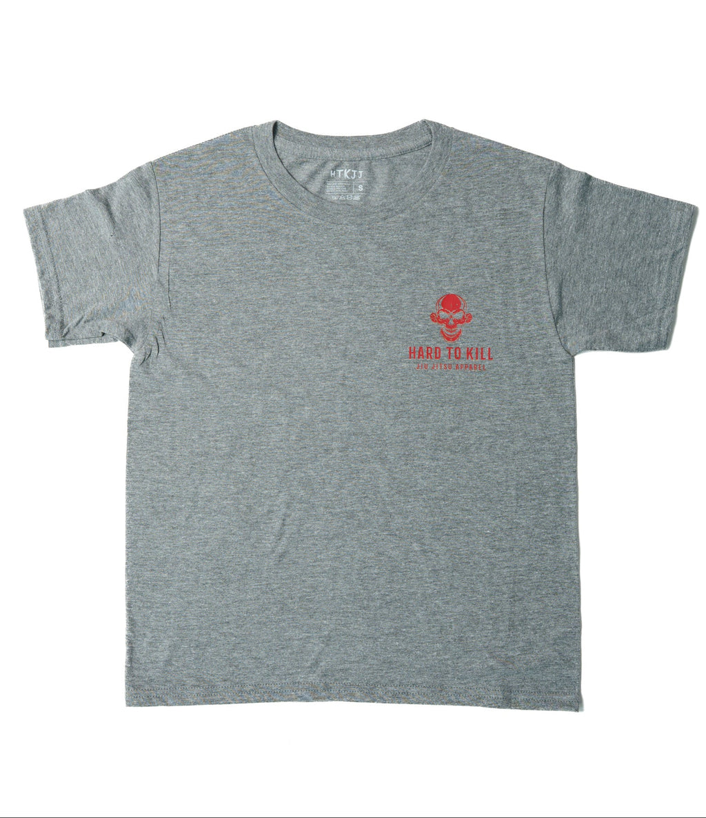 A heather gray short-sleeve t-shirt with a small red graphic on the left chest featuring a skull and the text 'HARD TO KILL' and 'THE DOG OF GOD'.